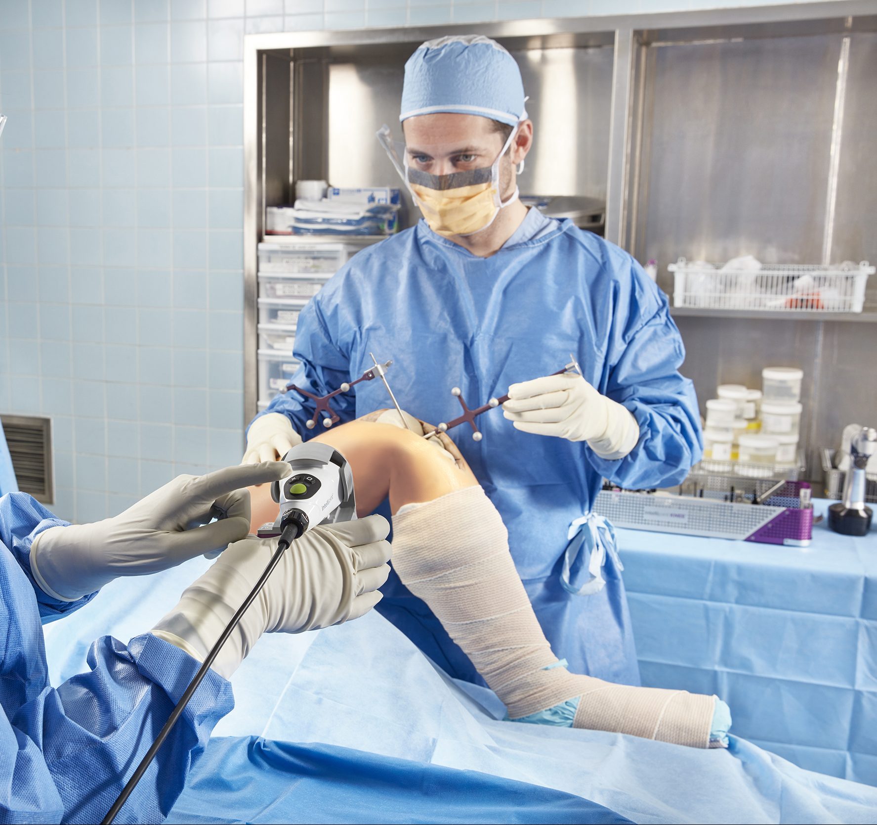 A surgeon using Intelljoint navigation tools.