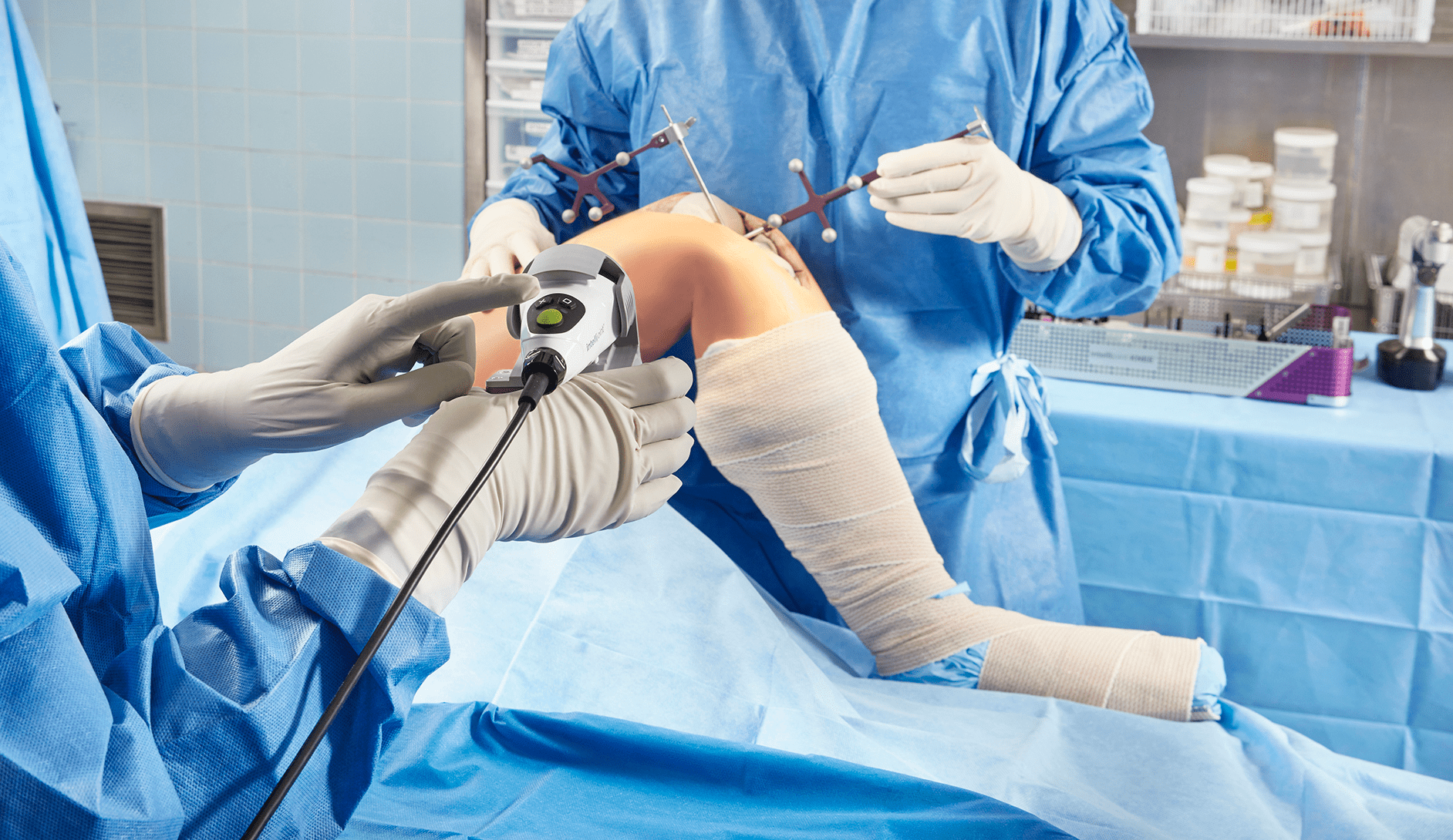 Surgeons performing knee replacement using computer-assisted surgery, Intellijoint KNEE