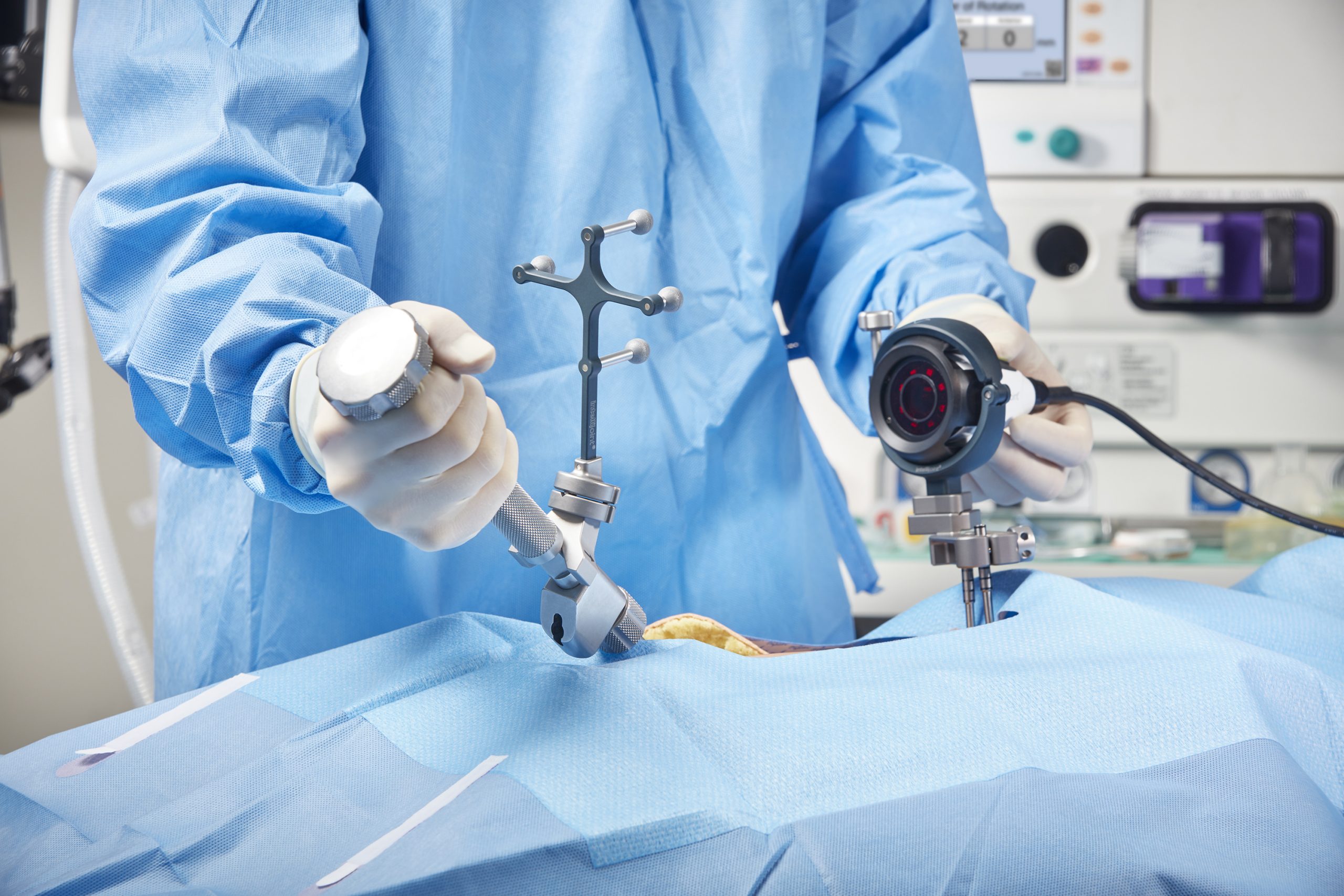 A surgeon using Intellijoint HIP to track intraoperative patient movement.