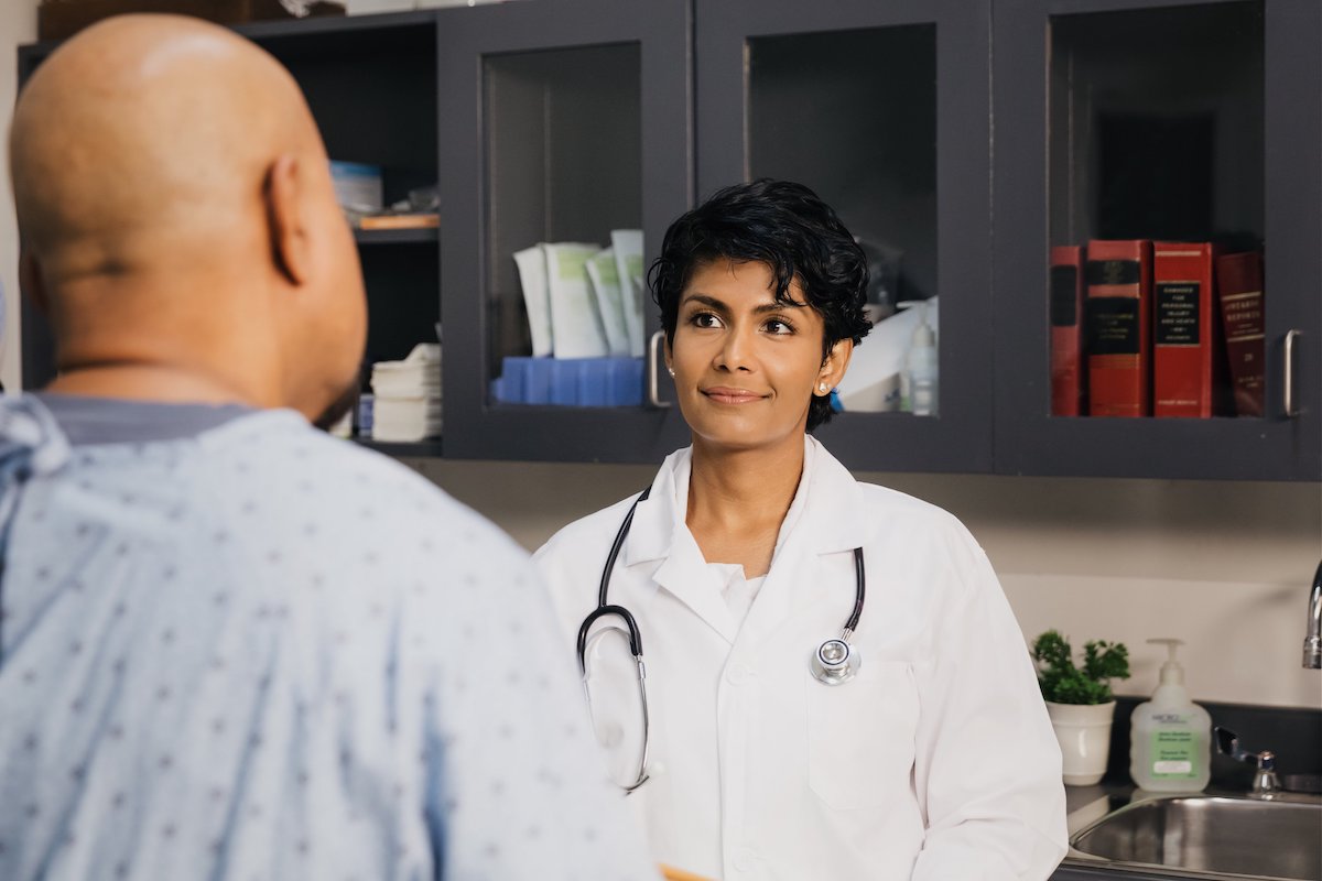 Female surgeon discussing hip surgical approach with a patient