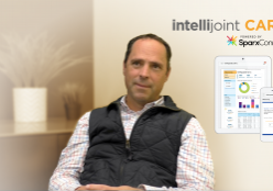 Dr. Bradley sitting with a screenshot of the Intellijoint CARE on the side