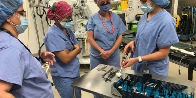 Surgeons gathered around Intellijoint HIP product