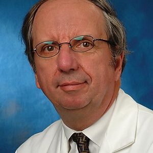 Ortho surgeon, Wayne Paprosky, with white lab coat